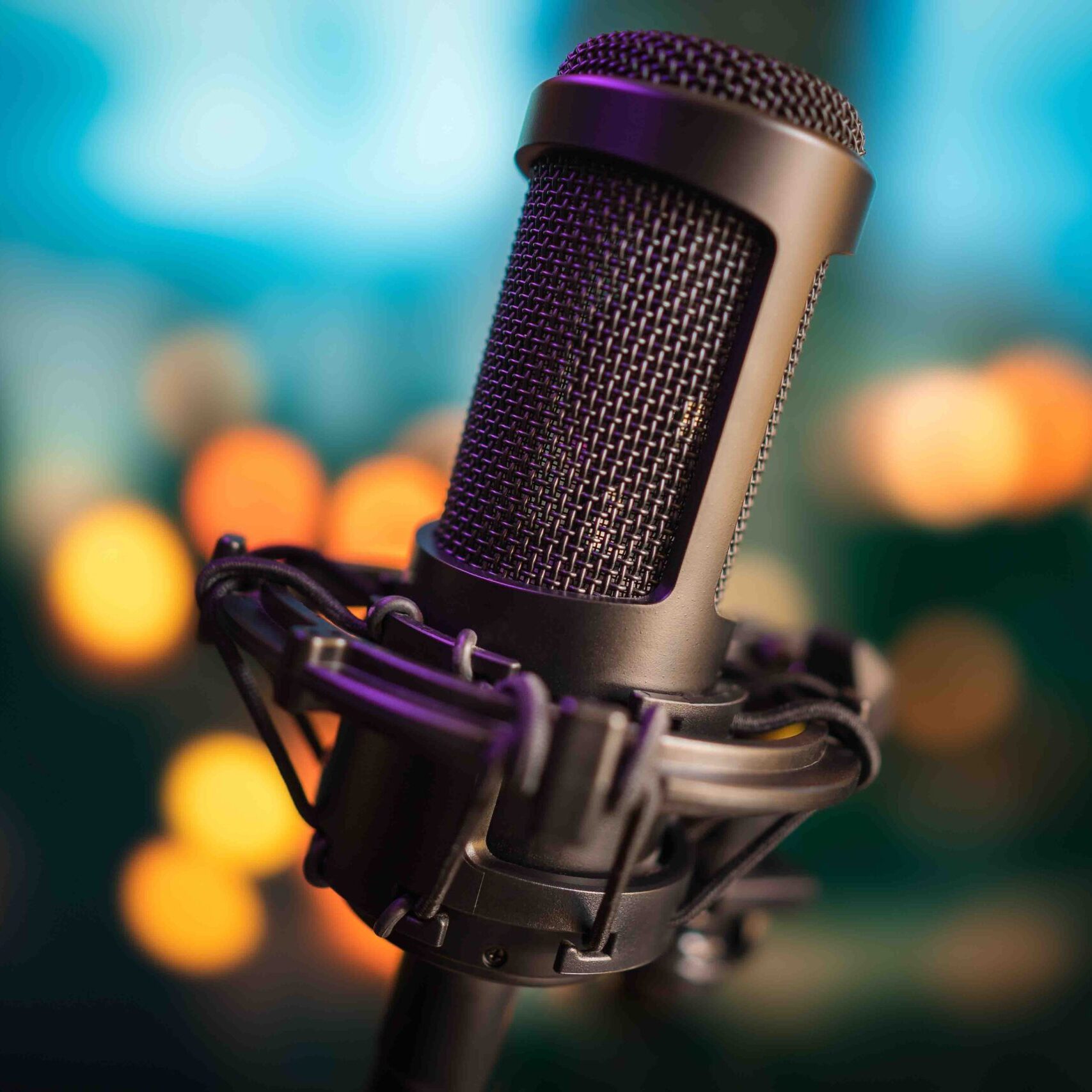 Professional studio microphone on blurred bokeh lights background